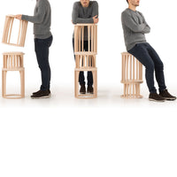 Natural wood stool with a sleek design, showcasing light tones and vertical slats for a modern aesthetic.