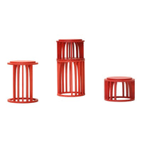 Set of three modern red stools with open lattice design, featuring a vibrant, contemporary color scheme.