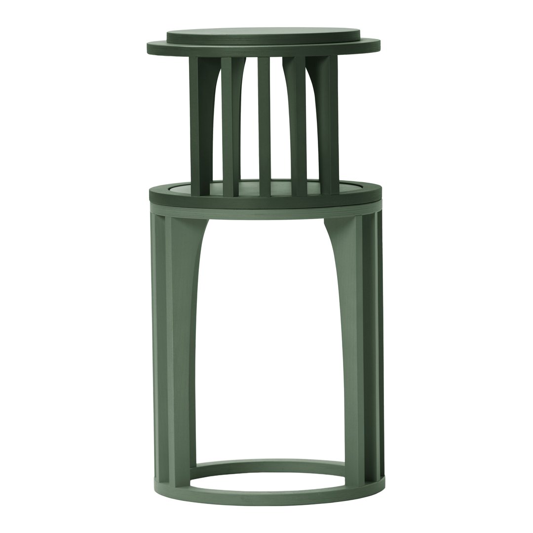 Green multi-level decorative stand with a modern geometric design. Ideal for showcasing plants or decorative items.