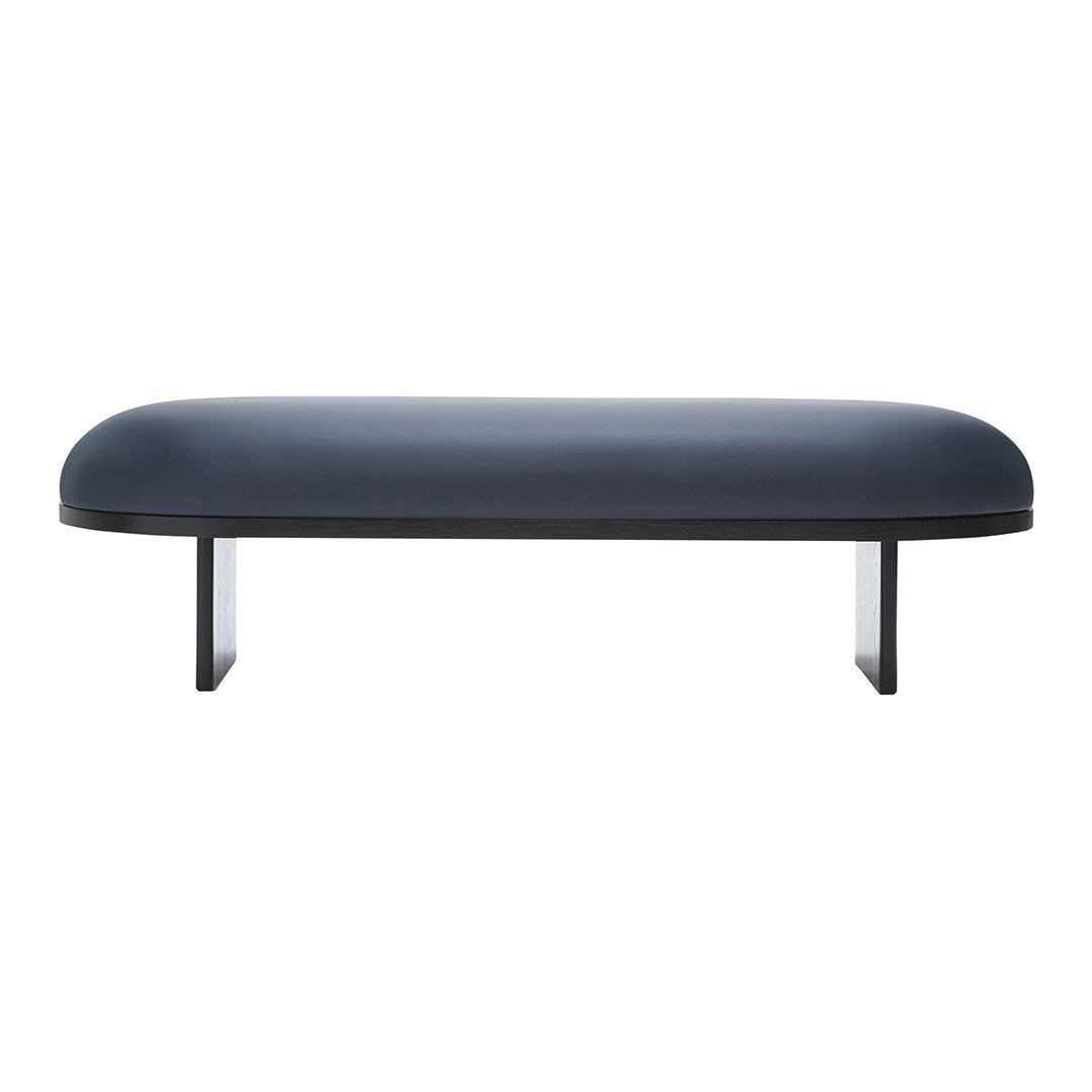 Sleek dark blue bench with a smooth, rounded top and minimalist black metal legs, perfect for modern decor.