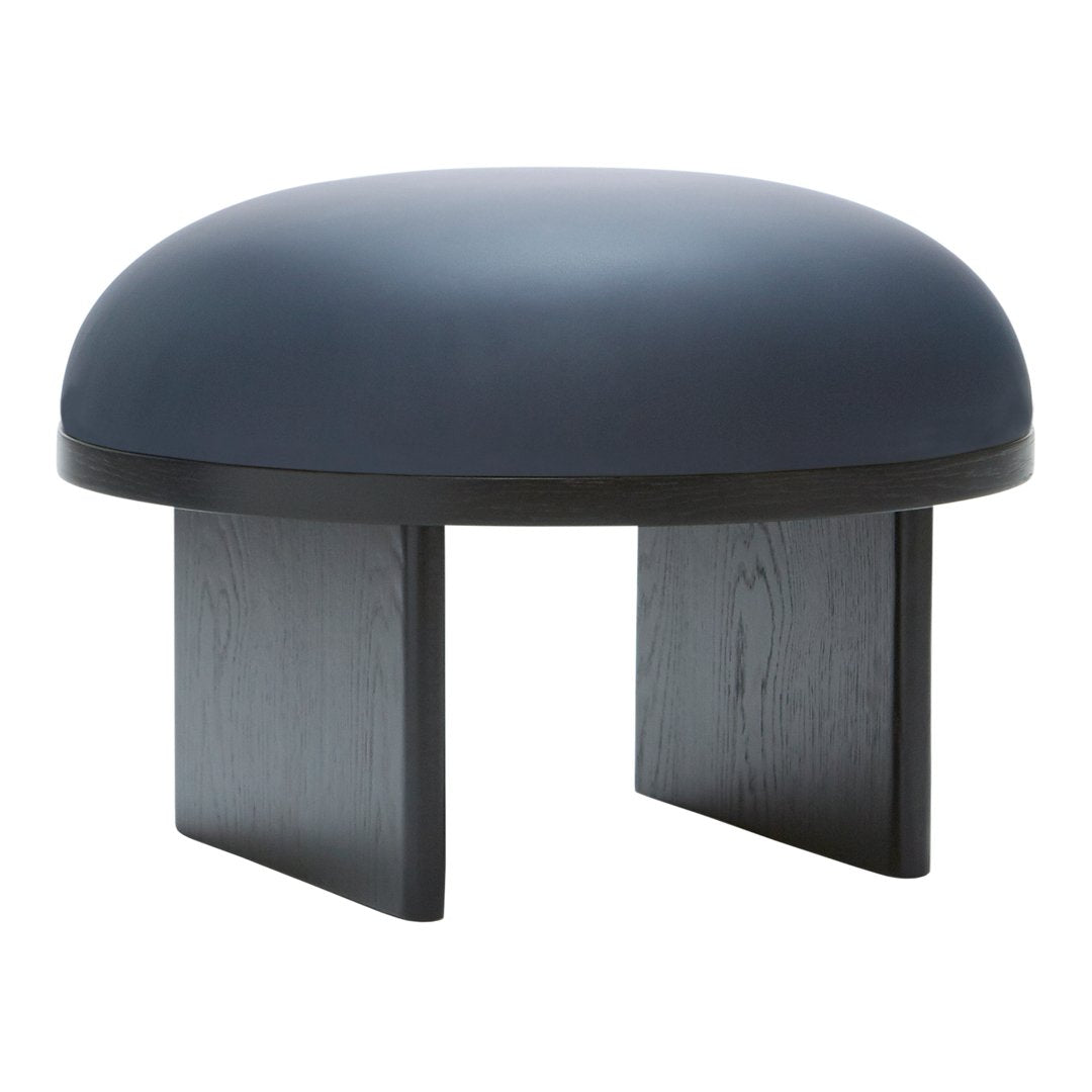 Navy blue dome-shaped ottoman with a matte finish and black wooden legs, perfect for modern interiors.