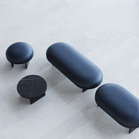 Modern furniture set in sleek black and dark blue tones with smooth, rounded shapes and minimalistic design.