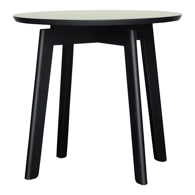 Black round table with sleek legs, featuring a minimalist design and smooth surface for modern decor.