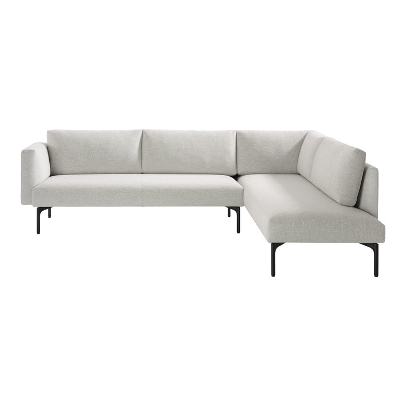 Modern L-shaped sofa in light gray fabric with subtle texture, featuring sleek black metal legs. Perfect for any living space.