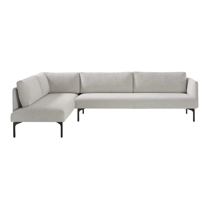Light gray sectional sofa with clean lines and minimalistic design, featuring soft cushions and sleek black legs.