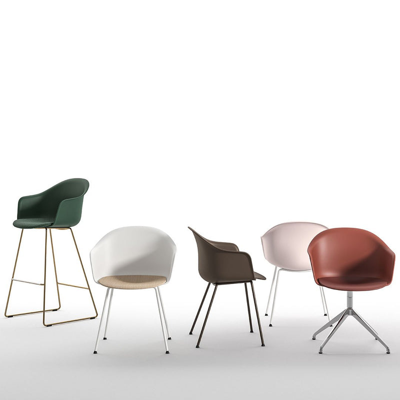 Colorful modern chairs in green, white, brown, pink, and rust; featuring various patterns and sleek designs.