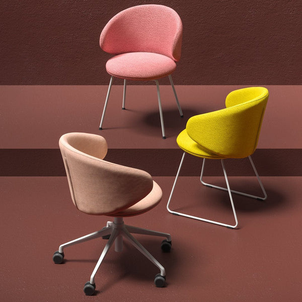 Colorful upholstered chairs in pink, yellow, and soft fabric textures on a brown backdrop. Stylish and modern design.