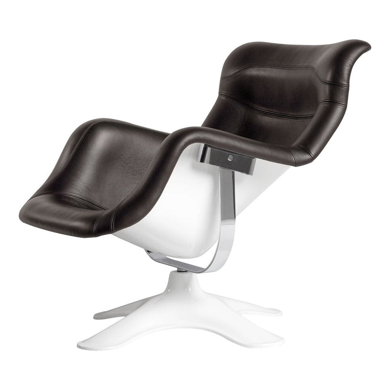 Modern black and white lounge chair with smooth leather upholstery and a sleek chrome base. Stylish and contemporary design.