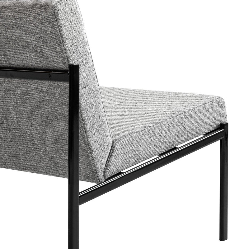 Gray upholstered chair with a sleek black metal frame, showcasing a minimalist design and textured fabric.