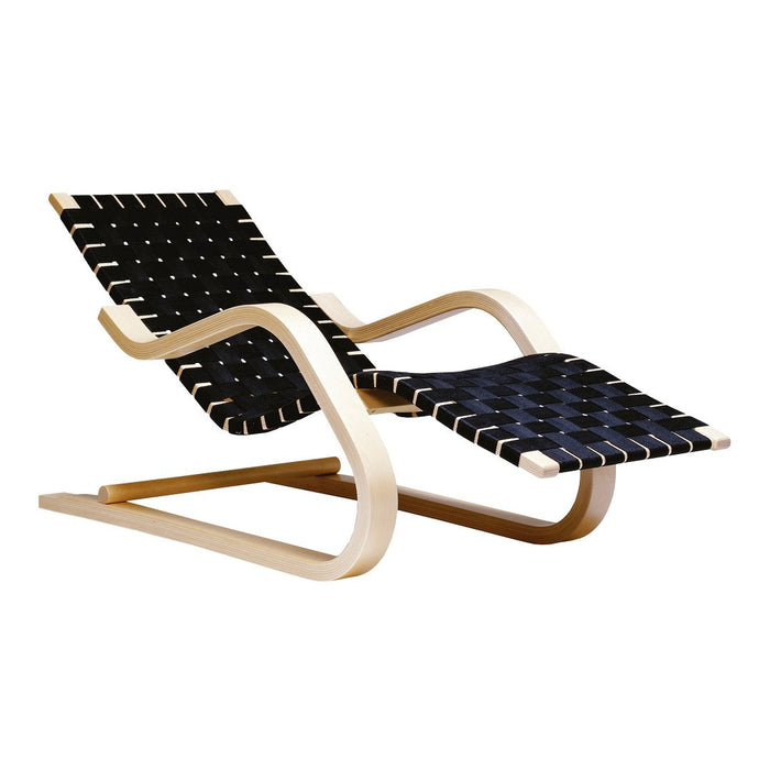 Black and white woven pattern lounge chair with natural wood frame, perfect for modern decor.