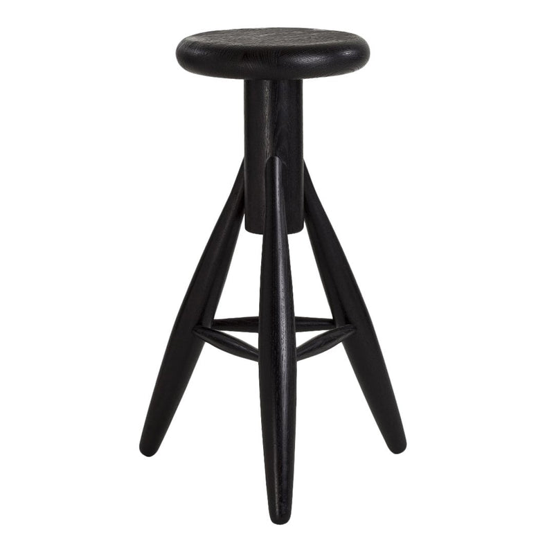 Black wooden stool with a round seat and angular legs, featuring a sleek, minimalist design.