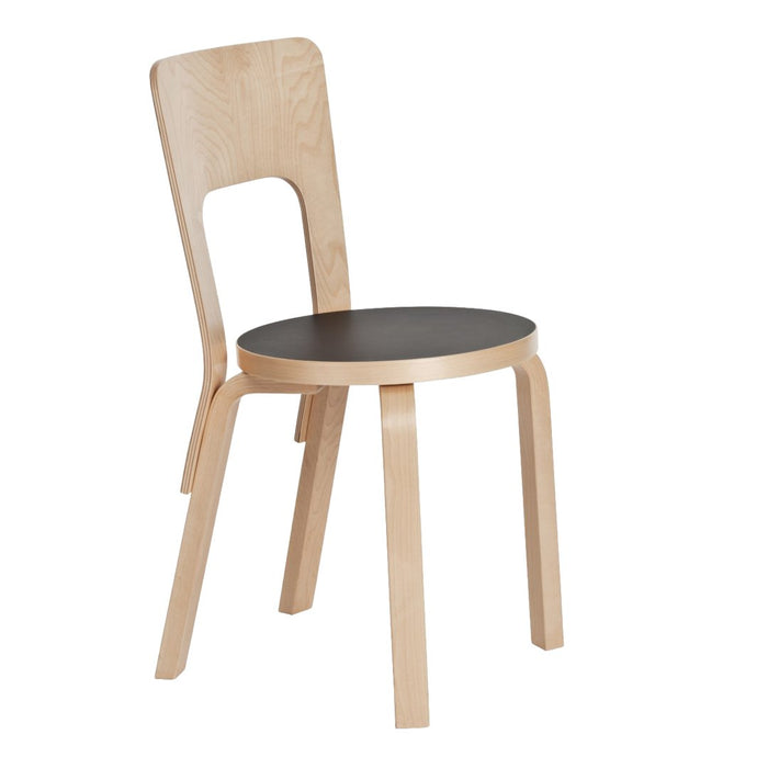 Light wood chair with a natural finish and a contrasting black round seat, featuring a sleek, minimalist design.