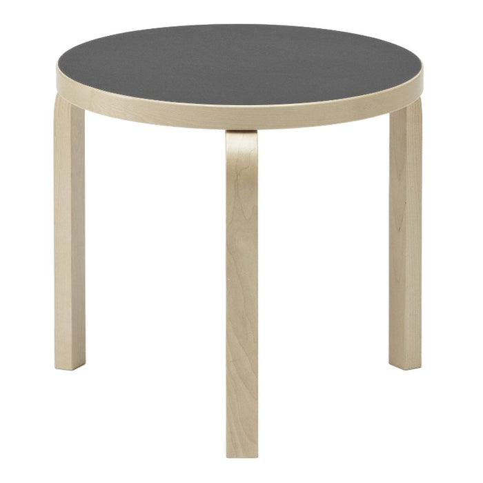 Round table with a sleek gray top and light wooden legs, showcasing a modern, minimalistic design.