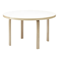 Round table with a sleek white top and light beige wooden legs, featuring a simple, modern design.