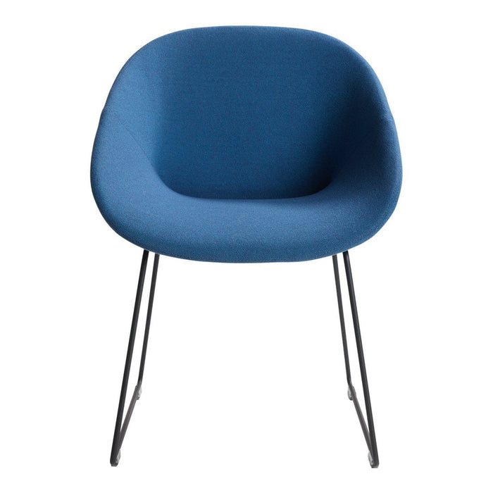 Blue upholstered chair with smooth, rounded contours and black metal legs for a modern aesthetic.