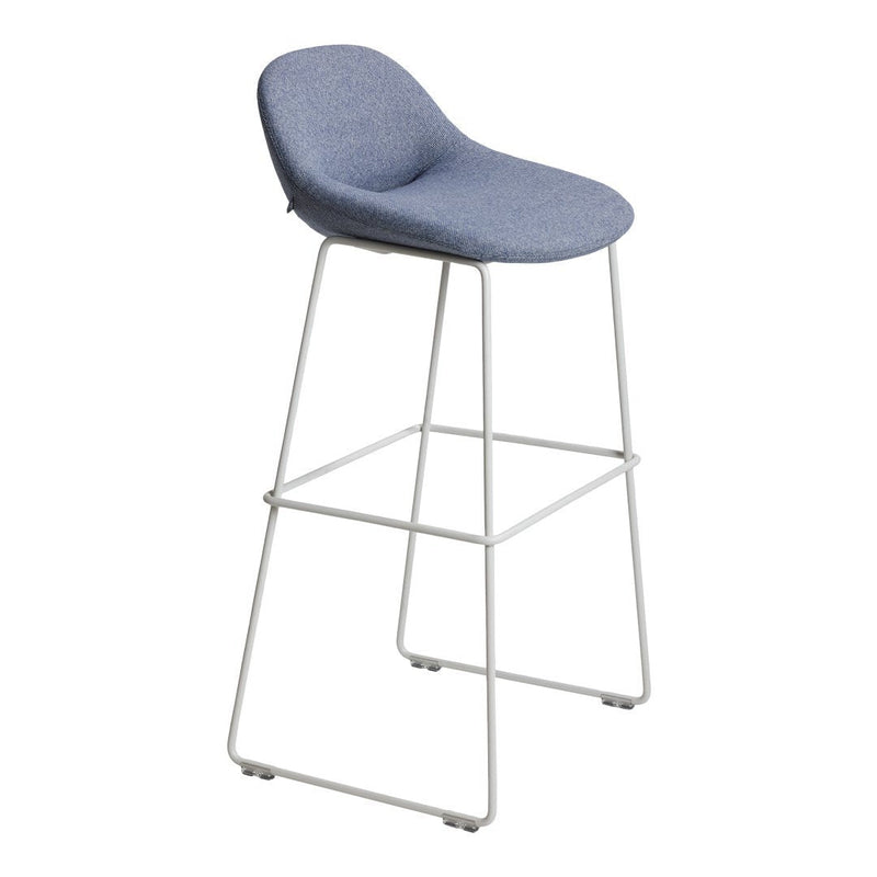 Blue upholstered bar stool with a smooth texture and sleek white metal frame. Modern design for contemporary spaces.