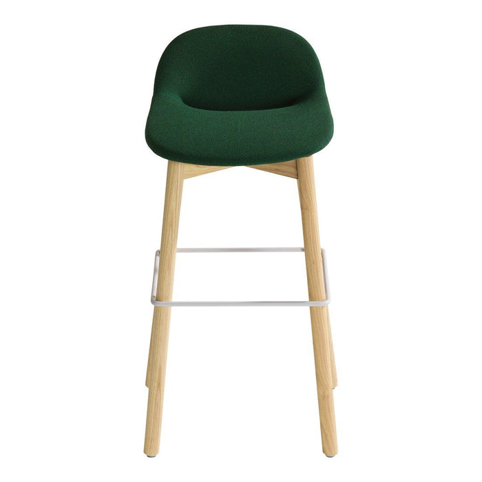 Green upholstered bar stool with natural wood legs and a sleek, minimalist design, perfect for modern decor.