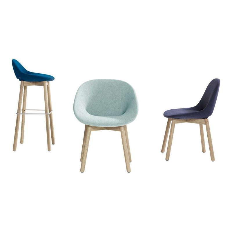 Three modern chairs in blue, mint green, and dark navy, featuring smooth upholstery and light wood legs.