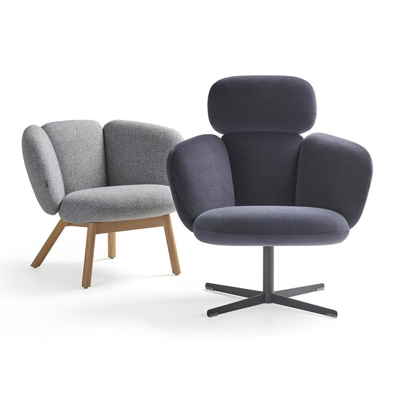 Gray and navy upholstered chairs with modern shapes and textures, featuring wood and metal bases.