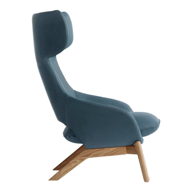 Sky blue upholstered lounge chair with a modern design and natural wood legs. Perfect for stylish interiors.