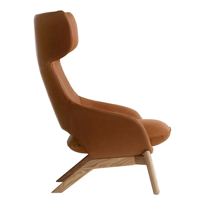Brown upholstered armchair with smooth contours and a minimalist wooden base.
