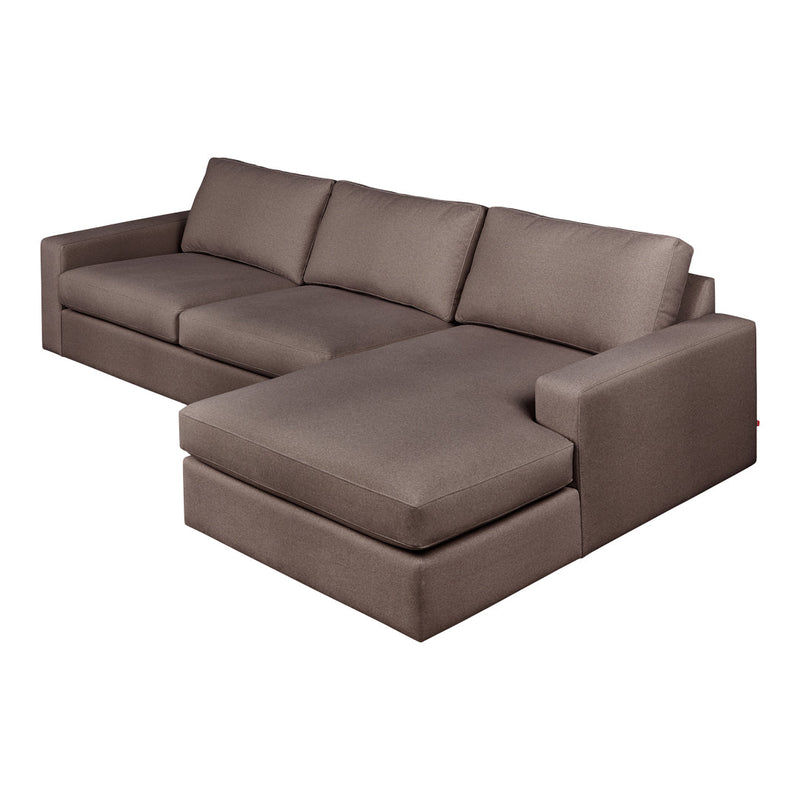 "Modern L-shaped sofa in neutral brown fabric with clean lines and no visible patterns."