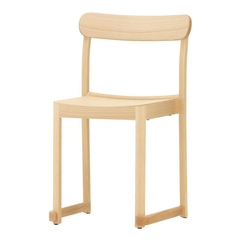 Natural wood chair with a light, minimalist design and smooth, unblemished finish. Ideal for modern interiors.