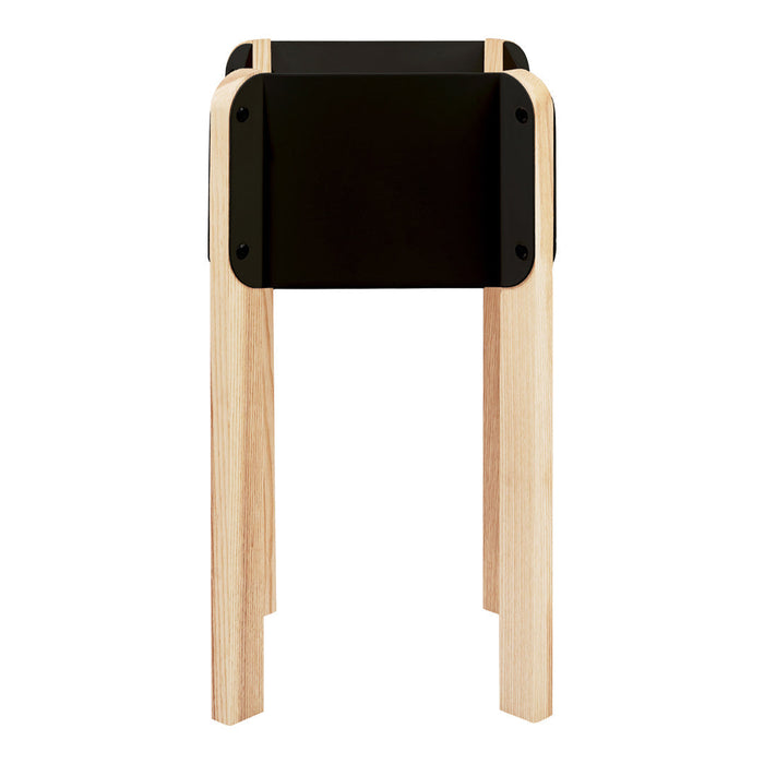 Black tabletop with natural wood legs, featuring a sleek, modern design and minimalistic style.