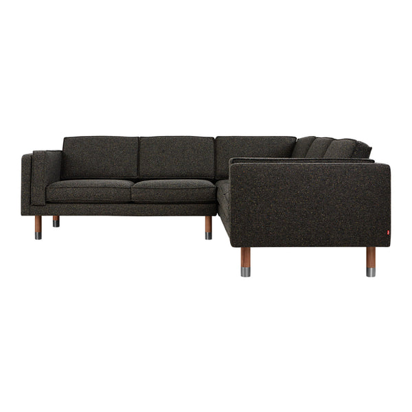 Dark gray upholstery with a subtle texture, complemented by wooden legs in a modern, minimalist design.