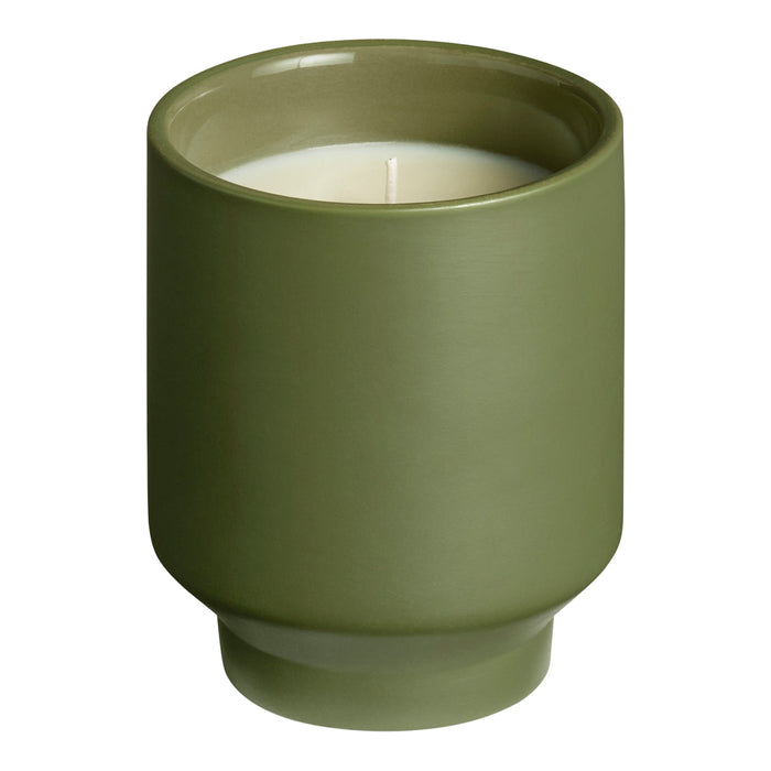Green ceramic candle holder with a smooth matte finish and a minimalist design. Perfect for modern decor.