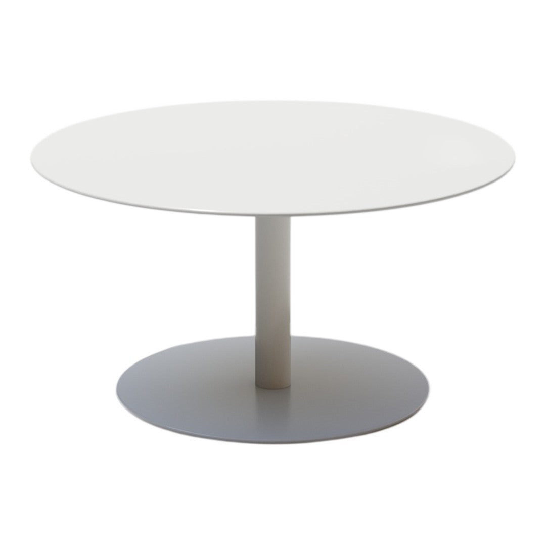 Round white dining table with a smooth surface and sleek silver base, perfect for modern decor.