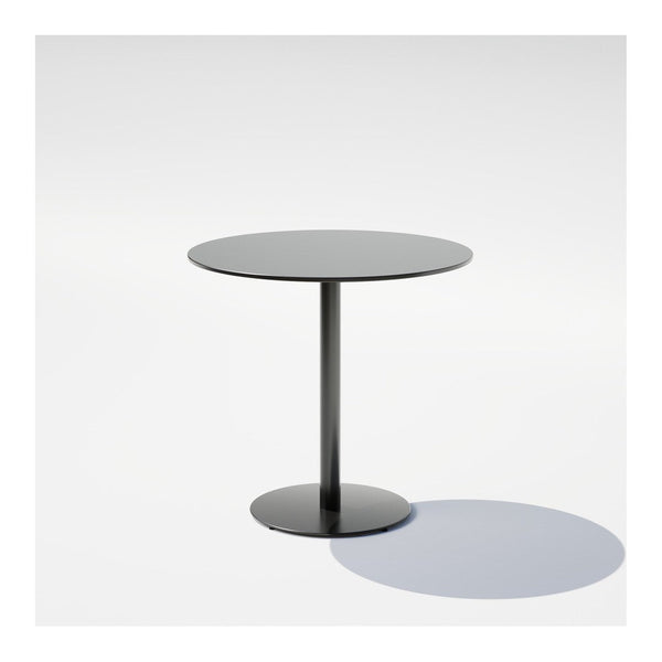 Black round table with a sleek surface and minimalist design, featuring a smooth finish and a circular base.