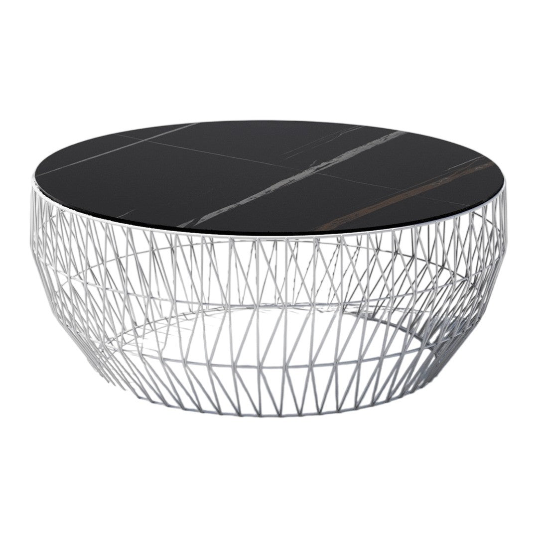 Round coffee table with a sleek black marble top and a geometric wireframe base in silver. Elegant modern design.
