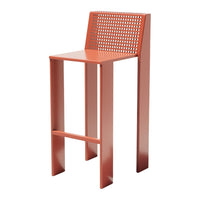 Modern high bar stool in a vibrant terracotta color with a perforated backrest for added texture and style.