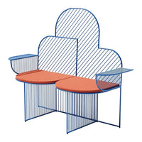 Blue striped wire frame loveseat with orange round cushions and sleek modern design. Perfect for vibrant outdoor spaces.