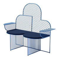 Blue metal bench with a cloud shape, featuring striped backrest and circular seat patterns. Modern design aesthetic.