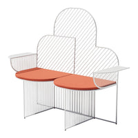 Modern bench featuring a white geometric frame and vibrant orange circular seats for a stylish accent.