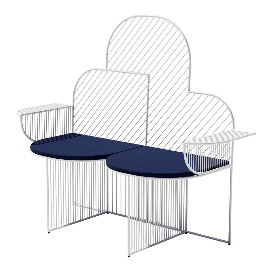 White wireframe bench with cloud-shaped backrest and navy blue cushions, featuring sleek, modern lines and patterns.