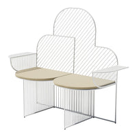 "Modern white wire bench with curved cloud shape and smooth beige tabletops, featuring clean lines and minimalistic design."