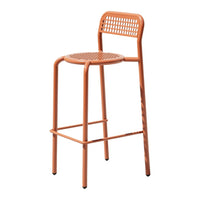 "Orange metal bar stool with a perforated seat and backrest, featuring a sleek modern design."