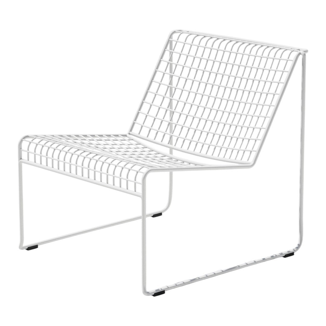 White wire lounge chair with a grid pattern and minimalist design, perfect for modern decor.