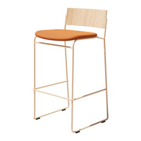 Light wood bar stool with a smooth orange cushion, featuring a sleek modern design and subtle geometric lines.