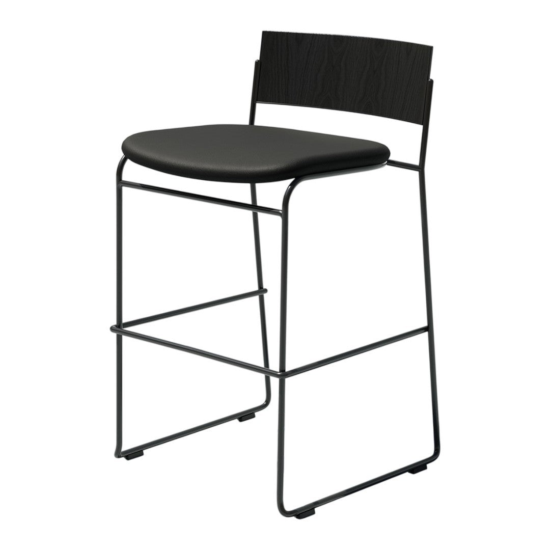 Black metal bar stool with a sleek design and smooth black seat, featuring minimalist lines and modern patterns.