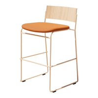Modern bar stool with a wood backrest and orange cushioned seat, featuring a minimal metal frame.
