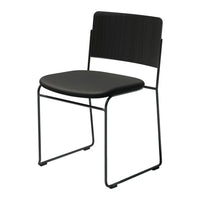 Black metal chair with a sleek, minimalist design featuring a smooth seat and vertical slat backrest pattern.