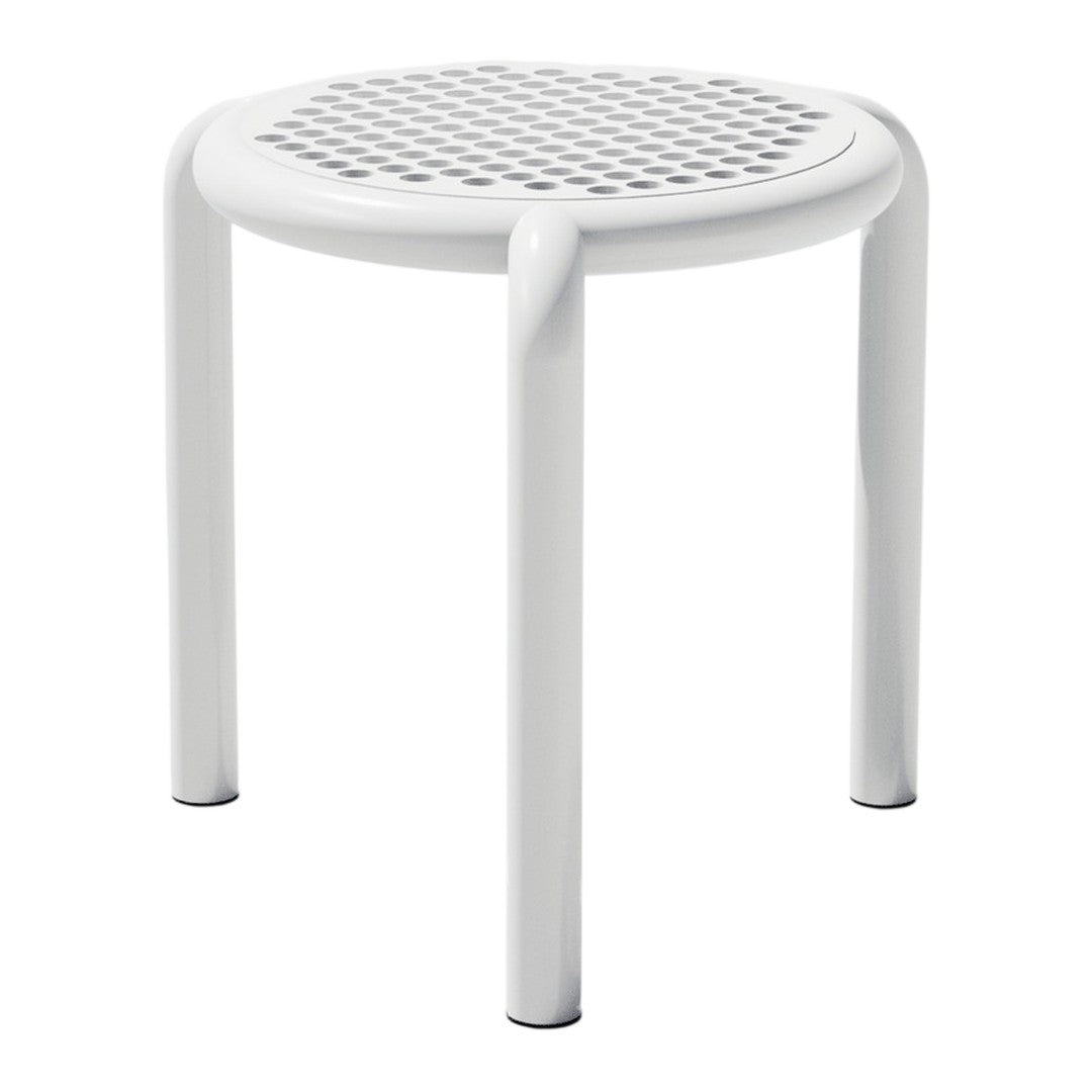 White round stool with a perforated pattern design and smooth, curved legs. Ideal for modern decor.