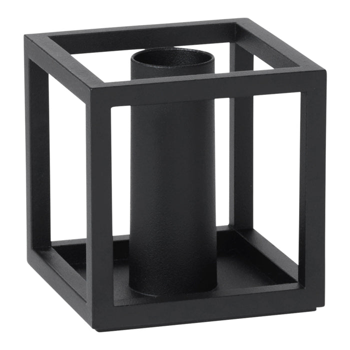 Black geometric candle holder with an open square design and cylindrical center. Modern minimalist decor accent.
