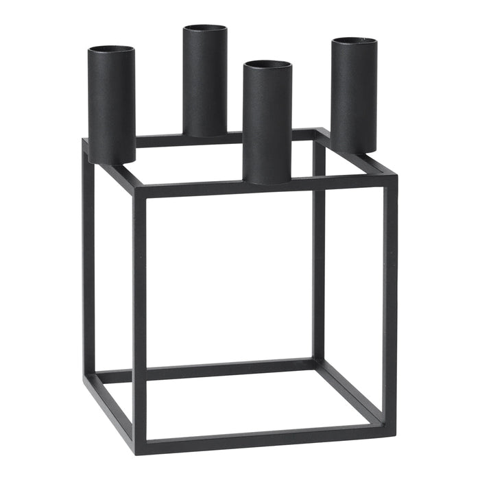 Black metal candle holder with a geometric square design and four cylindrical holders. Elegant and modern decor accent.