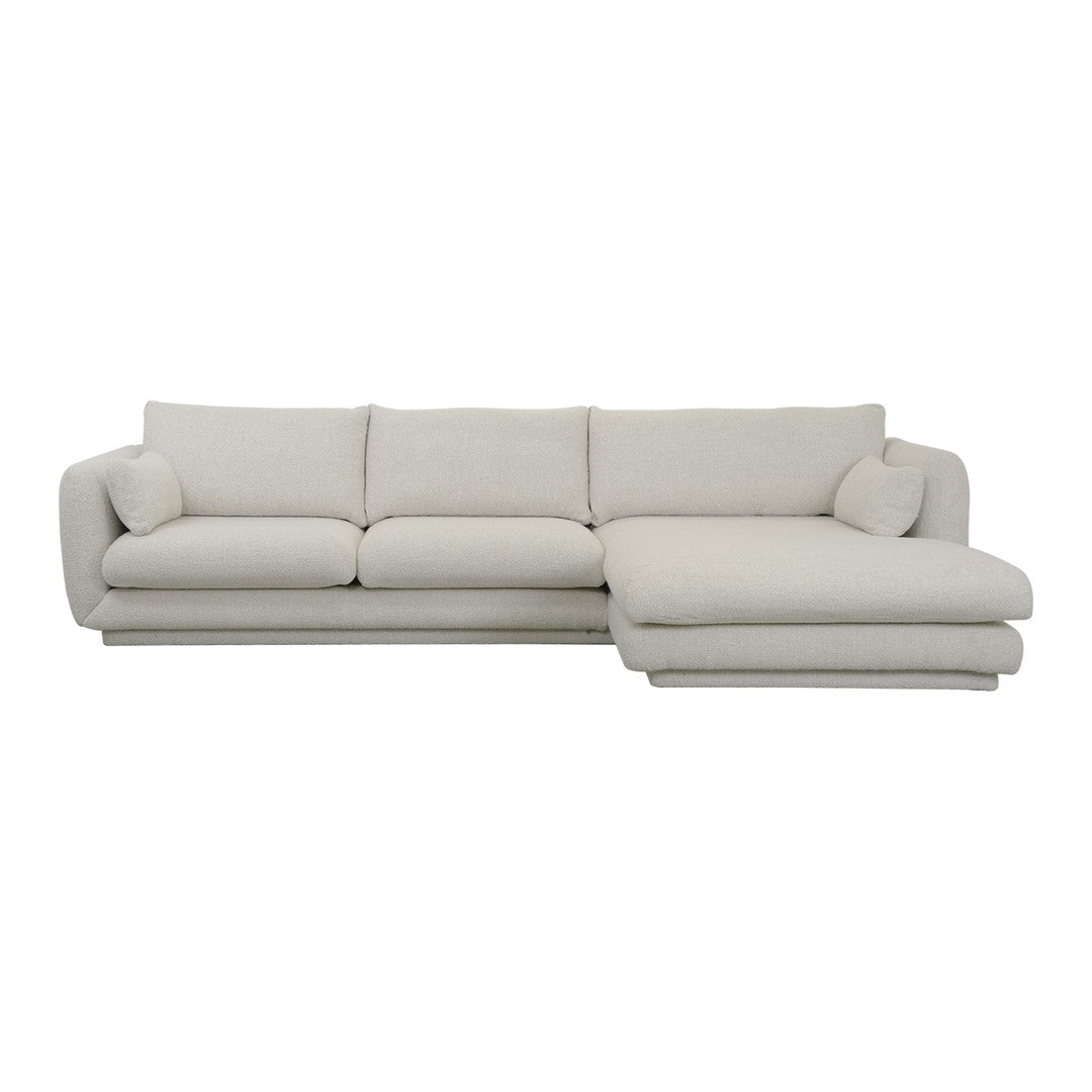 Light beige sectional sofa with soft, textured fabric and minimalistic design, perfect for modern living spaces.
