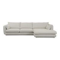 Light beige sectional sofa with soft, textured fabric and minimalistic design, perfect for modern living spaces.